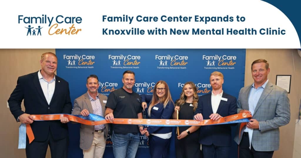 The Family Care Center Knoxville team celebrates its new clinic with a ribbon cutting event.