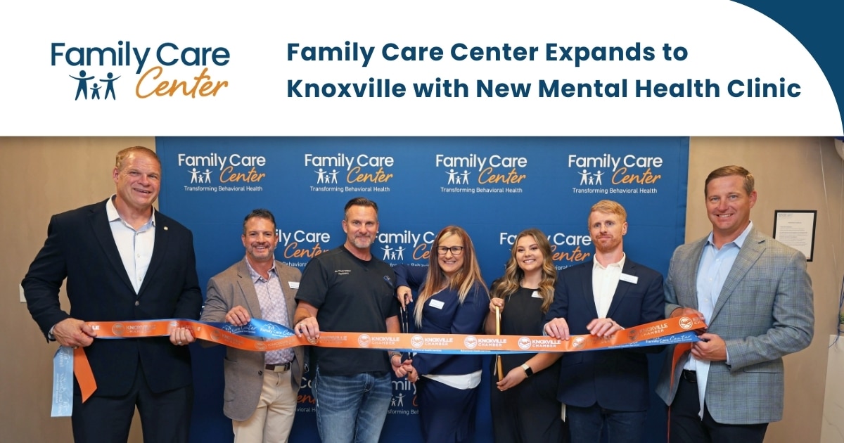 The Family Care Center Knoxville team celebrates its new clinic with a ribbon cutting event.