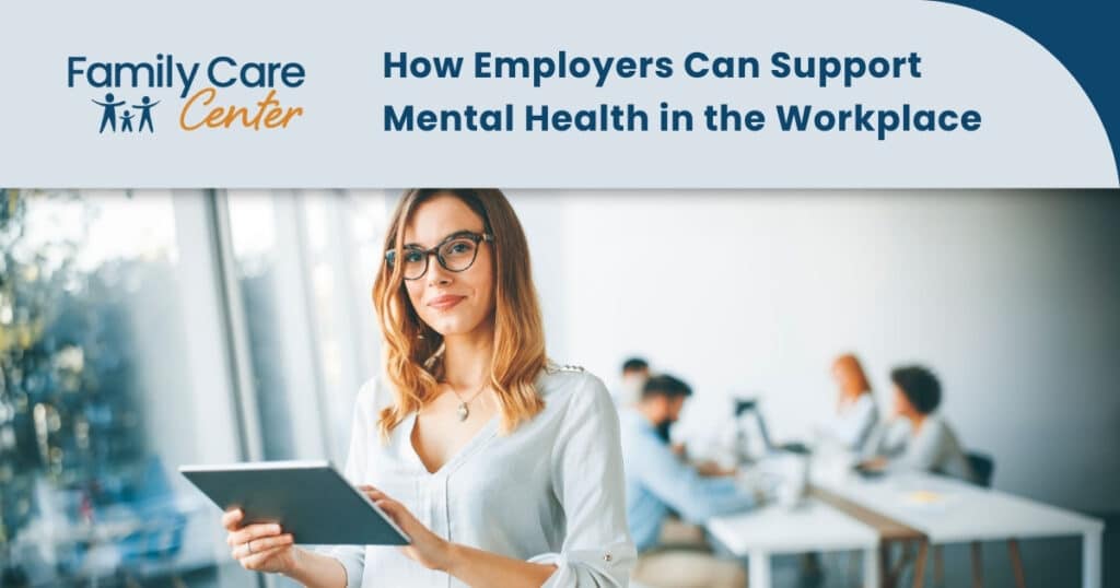 A female employer talks to her team about mental health in the workplace.