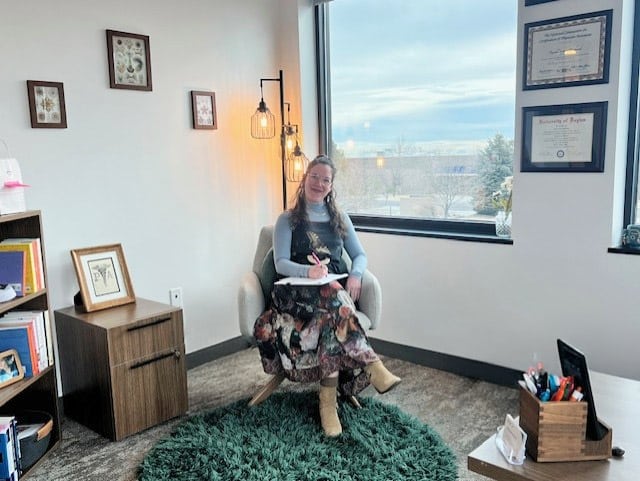 A Louisville, CO clinic mental health therapist is seeing a patient in her new office