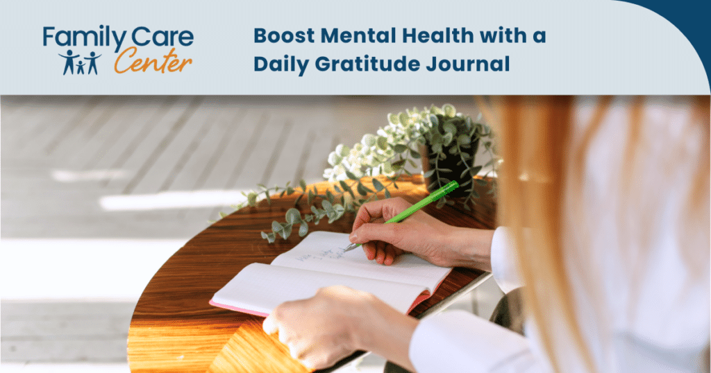 A woman writes in her gratitude journal.