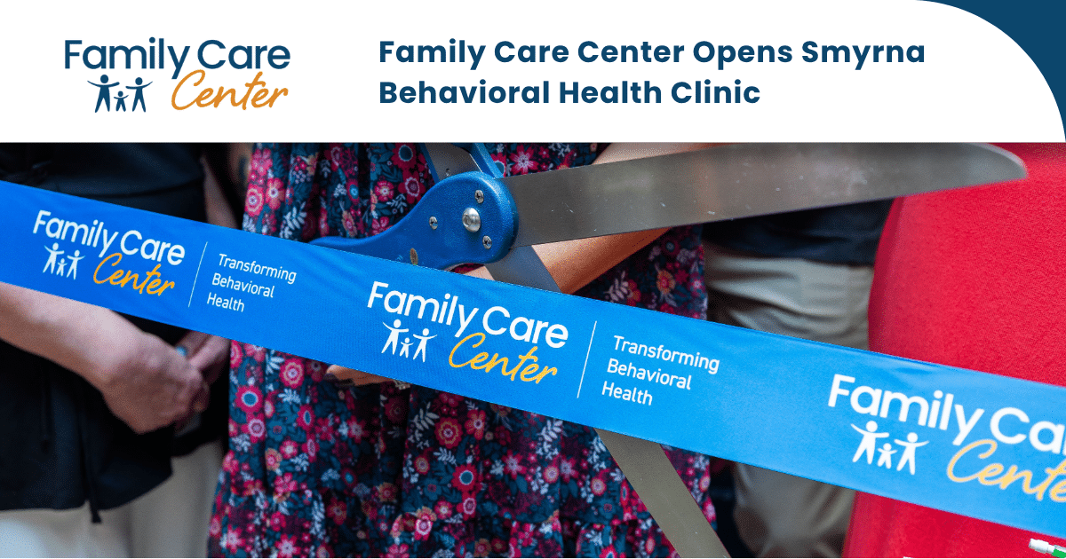 Team members cut a ribbon to celebrate the Smyrna clinic opening